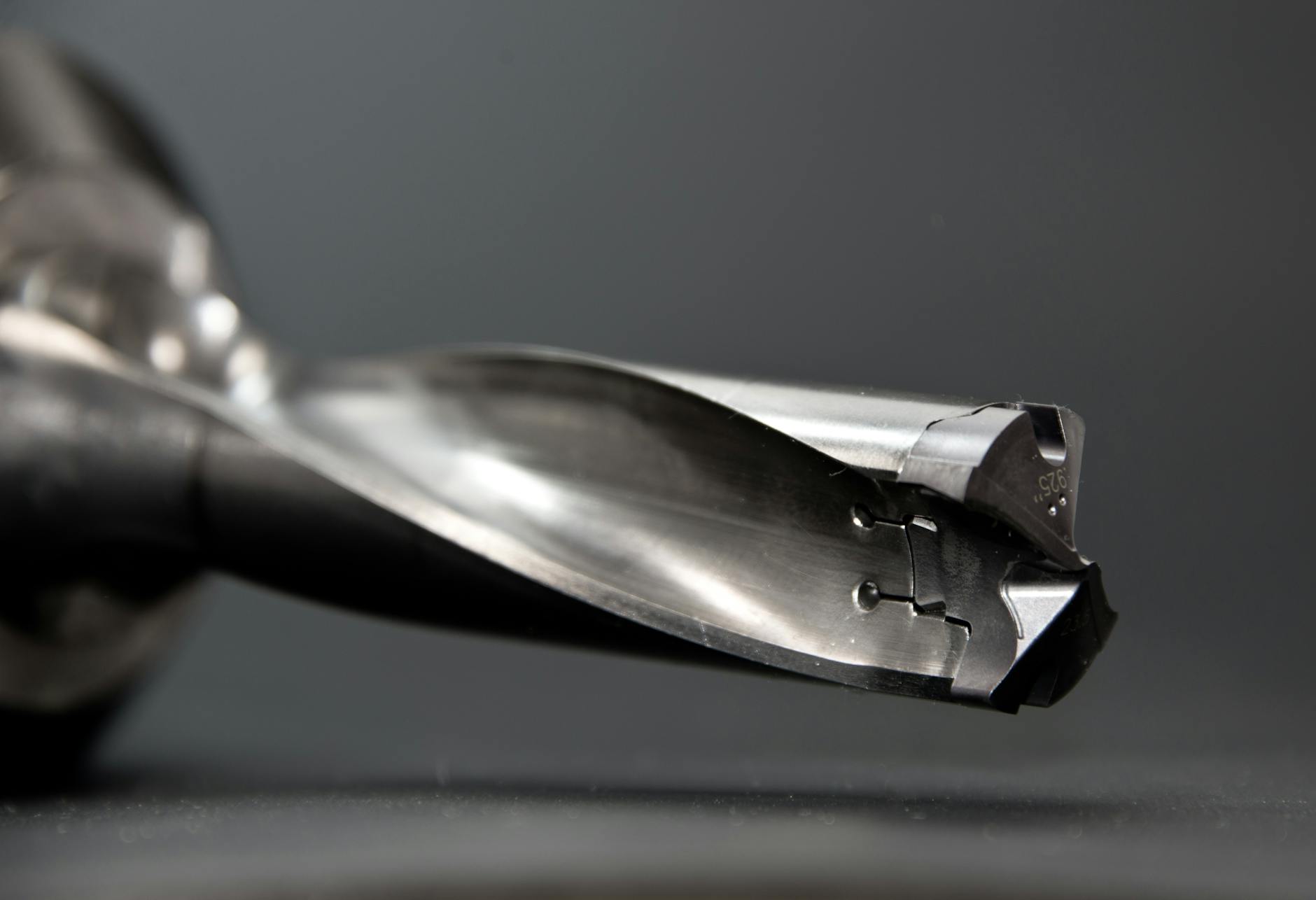 Detailed view of a sharp stainless steel drill bit, ideal for industrial use.