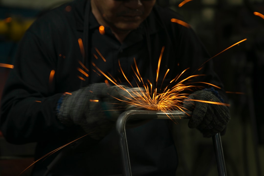 a man working on a piece of metal