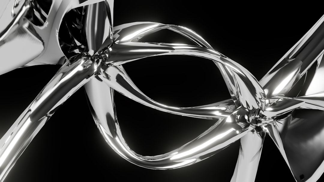 A close up of a metal object on a black background