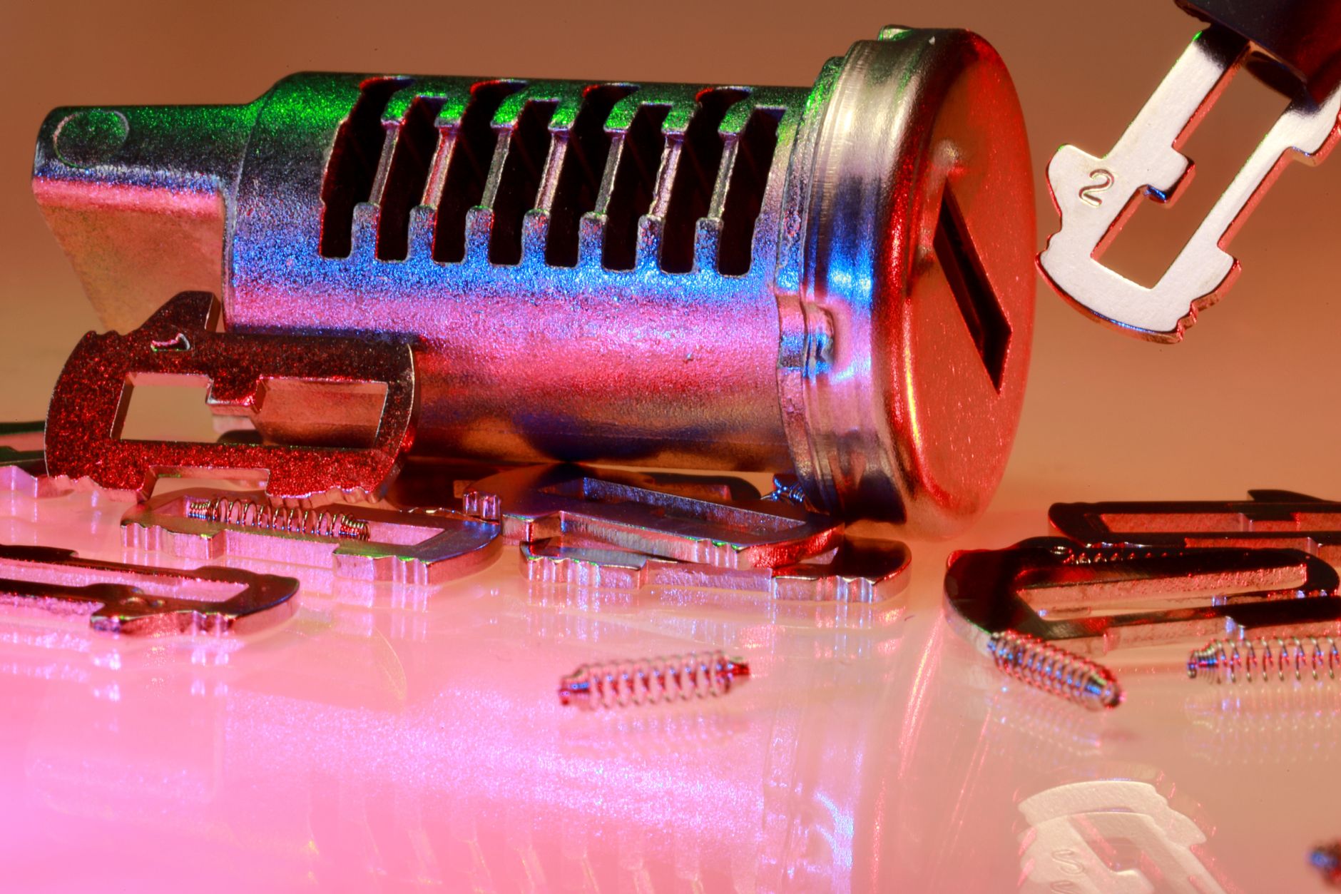 Detailed close-up of metal lock and key parts with colorful reflections, ideal for illustrating technology or security concepts.