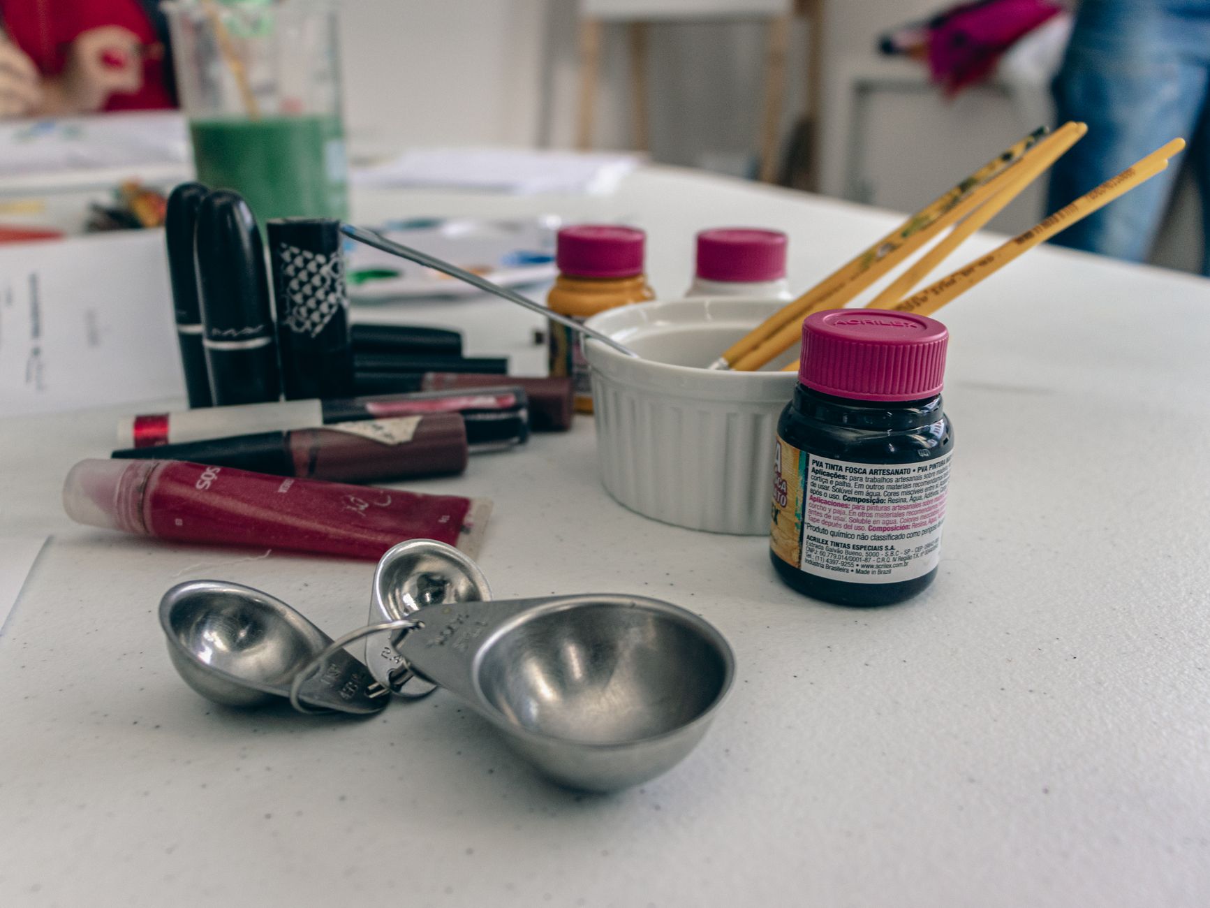 Art supplies and tools on a studio table, perfect for creative projects.
